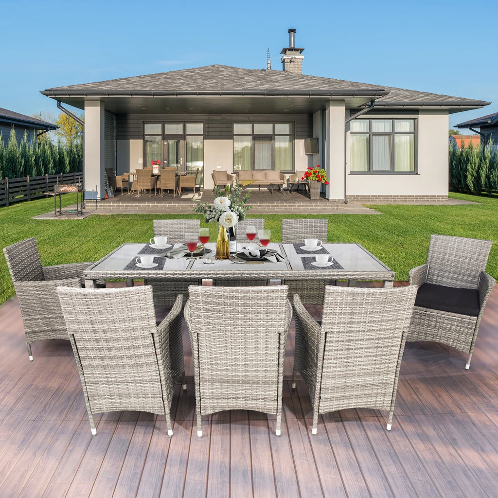 9 Pieces Wicker Outdoor Dining Set with Glass Tabletop and Cushioned Chairs G346